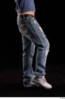 Hamza  1 blue jeans dressed flexing leg side view…